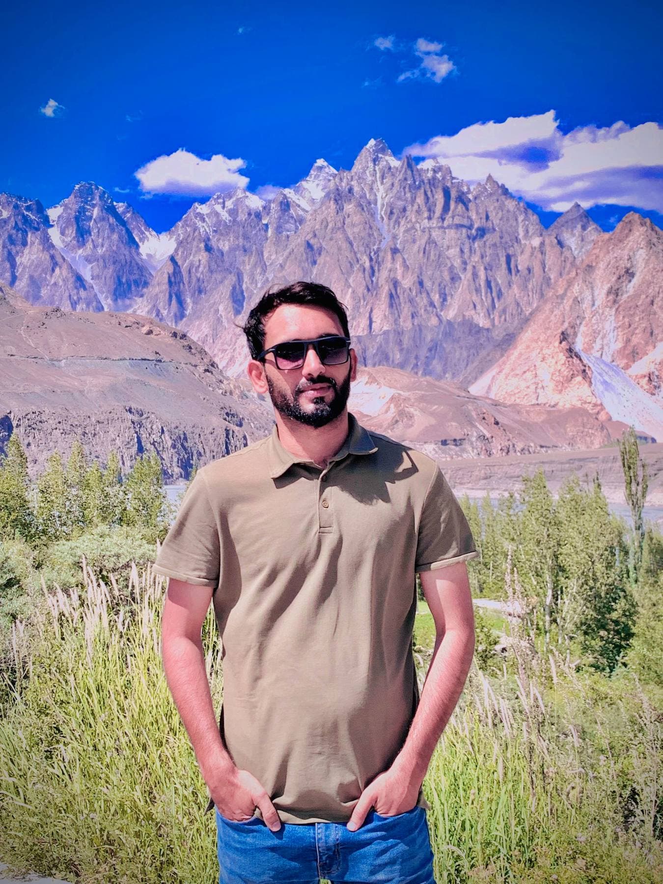 Another roadside backdrop — the mountains this time almost real enough.