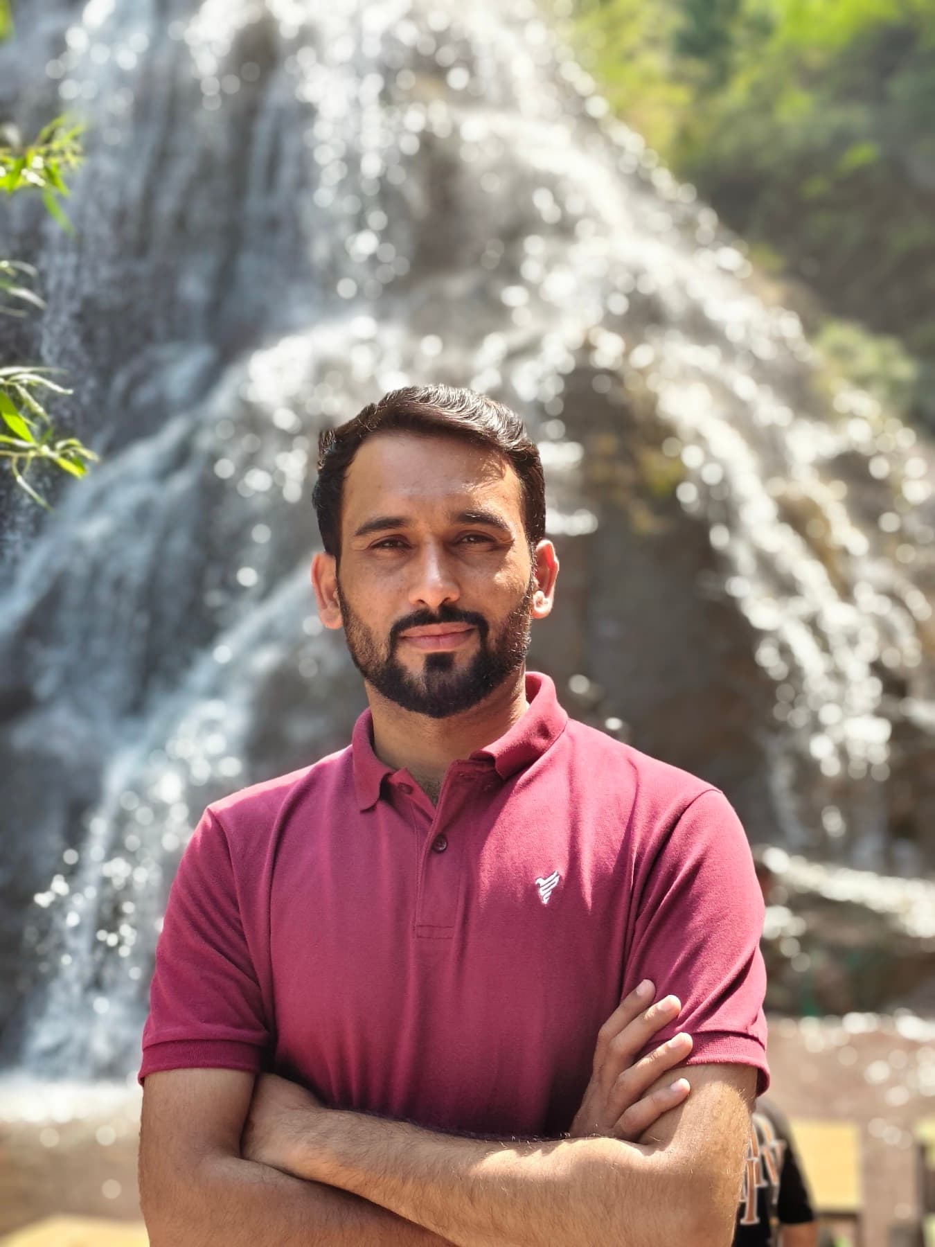 A roadside stop at a waterfall along the route.